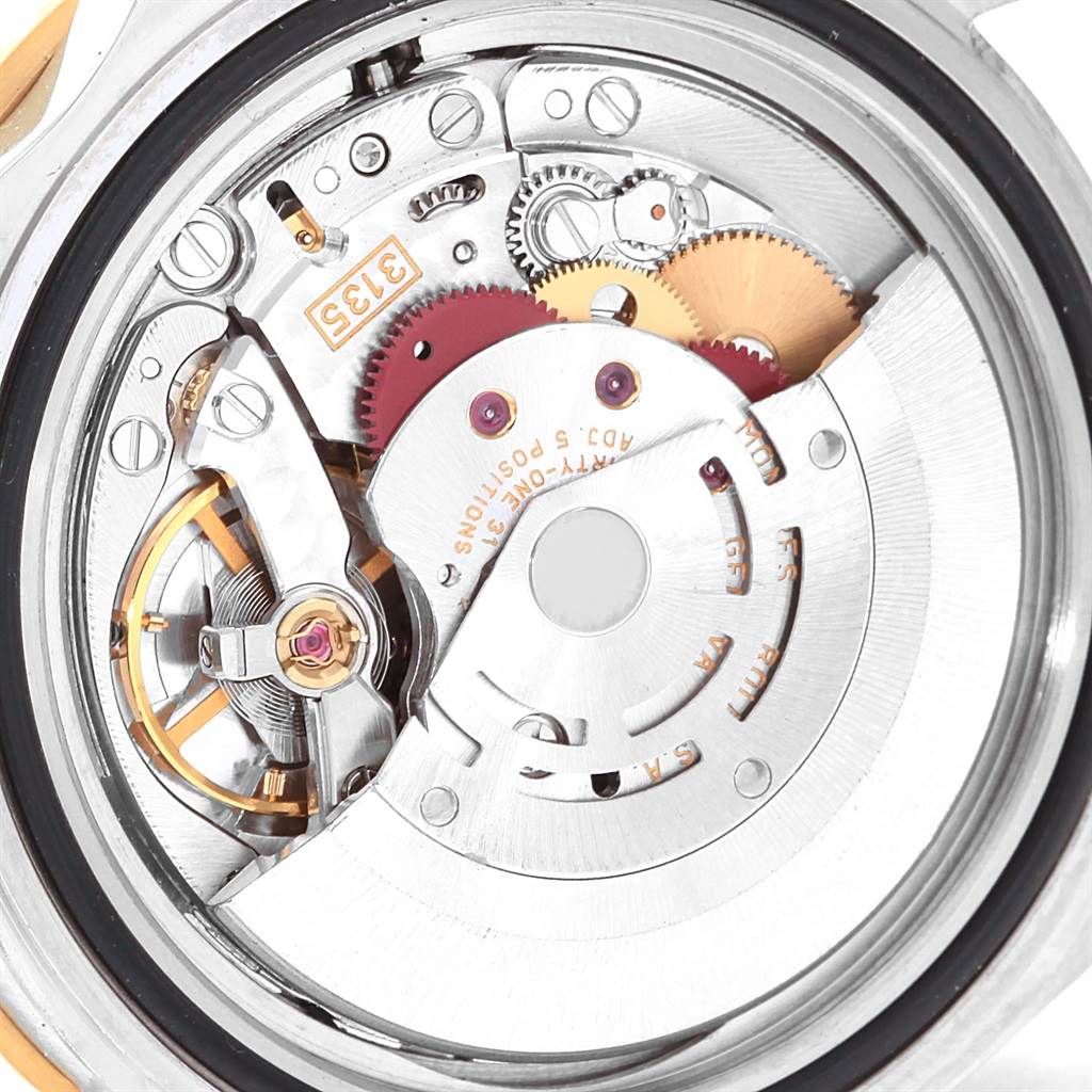 This image shows a close-up view of the movement mechanism inside the Rolex Submariner 16613 Men's Steel and Gold (two tone) Black Dial 16613 Men's Steel and Gold (two tone) Black Dial watch.