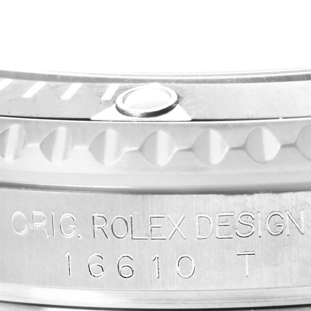 This image shows a close-up of the bezel and case with engraving details on a Rolex Submariner 16610 Men
s Stainless Steel Black Dial 16610 Men
s Stainless Steel Black Dial watch.