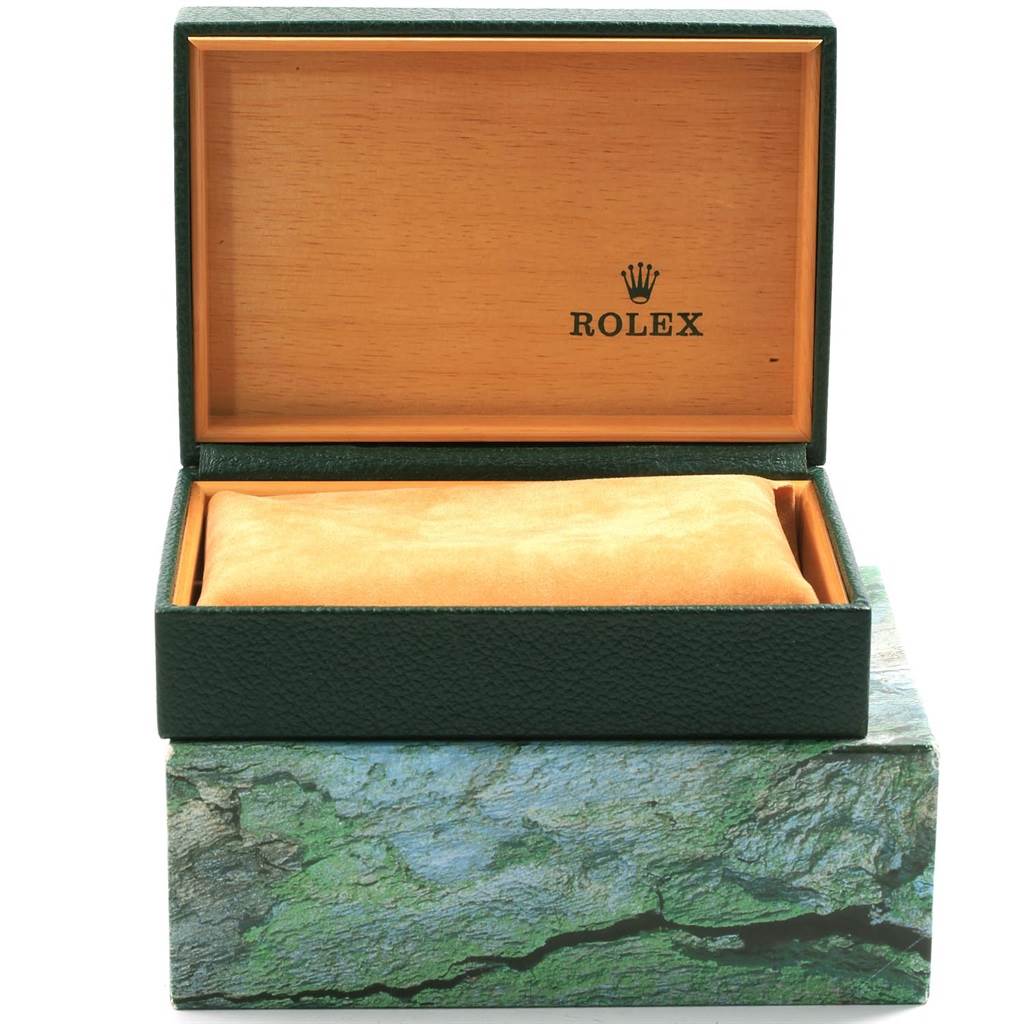The image shows an open Rolex watch box for the Submariner model, with the cushion inside but no watch present.