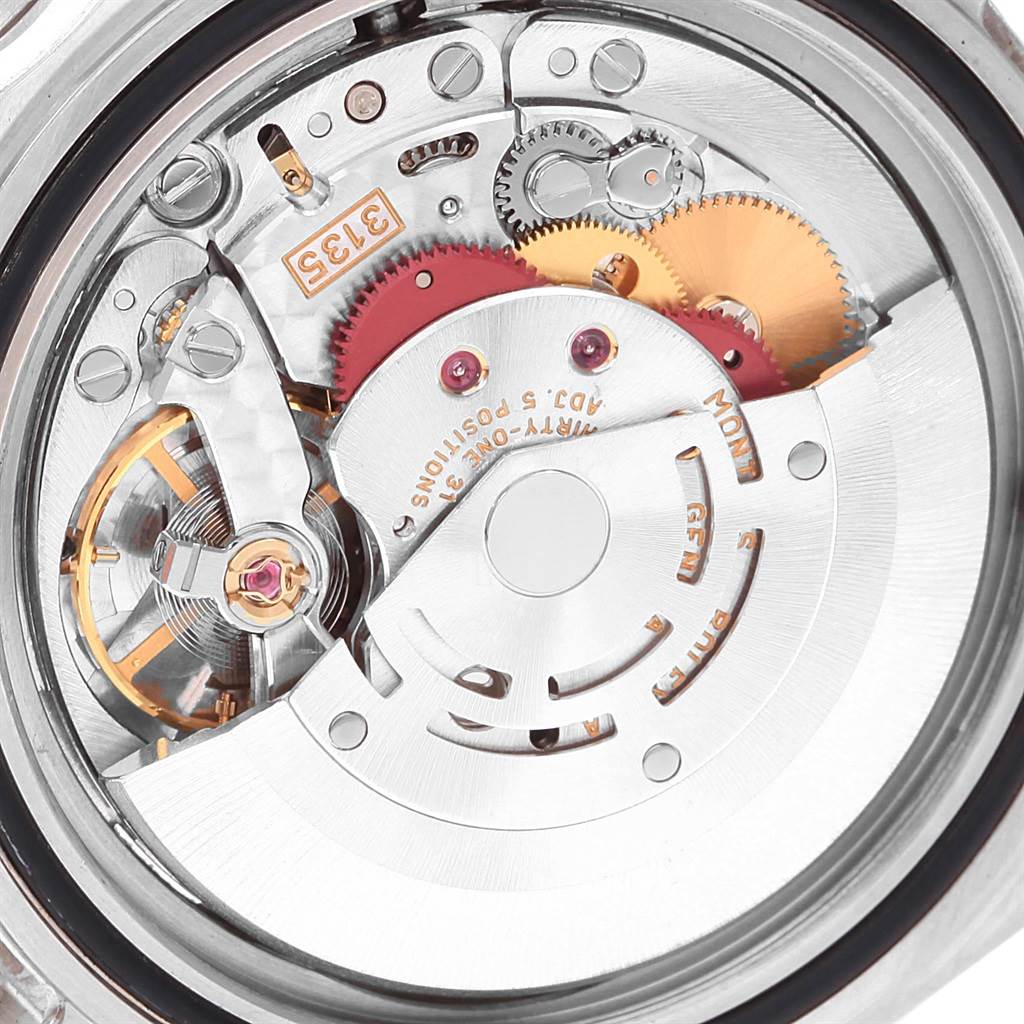 The image shows a close-up view of the movement and internal mechanisms of a Rolex Submariner 16610 Men
s Stainless Steel Black Dial 16610 Men
s Stainless Steel Black Dial watch.