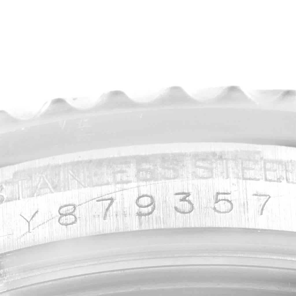 This image shows a close-up of the engraved serial number on the side of the Rolex Submariner 16610 Men
s Stainless Steel Black Dial 16610 Men
s Stainless Steel Black Dial watch case.