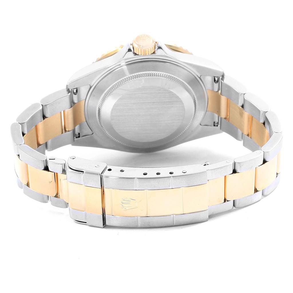 This image shows the back case and bracelet of a Rolex Submariner 16613 Men's Steel and Gold (two tone) Black Dial 16613 Men's Steel and Gold (two tone) Black Dial, emphasizing the two-tone metal design.