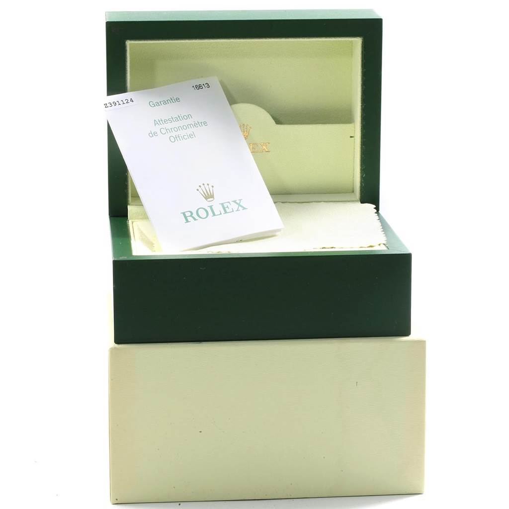 The image shows a Rolex Submariner 16613 Men's Steel and Gold (two tone) Black Dial 16613 Men's Steel and Gold (two tone) Black Dial watch box and warranty certificate from a slightly elevated front angle.