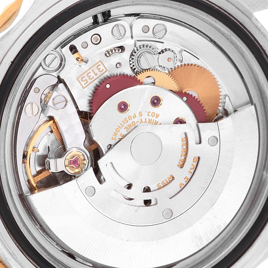 This image shows a close-up view of the movement mechanism inside a Rolex Submariner 16613 Men's Steel and Gold (two tone) Black Dial 16613 Men's Steel and Gold (two tone) Black Dial watch.