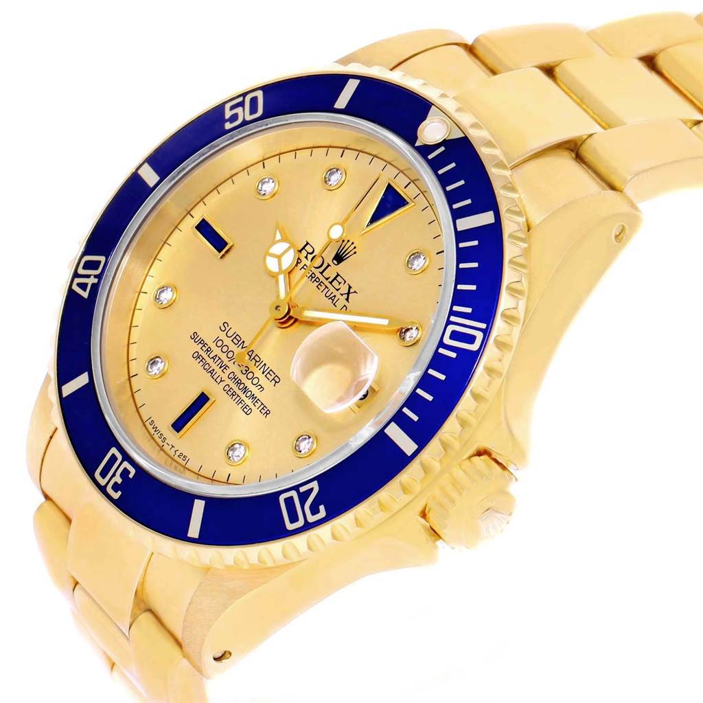 This Rolex Submariner 16618 Men's Yellow Gold Champagne Dial 16618 Men's Yellow Gold Champagne Dial watch is shown from a three-quarter angle, highlighting the face, bezel, and part of the bracelet.