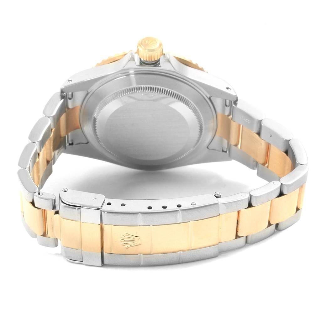 The image shows the back view of a Rolex Submariner 16613 Men's Steel and Gold (two tone) Blue Dial 16613 Men's Steel and Gold (two tone) Blue Dial watch, focusing on its caseback, bracelet, and clasp.