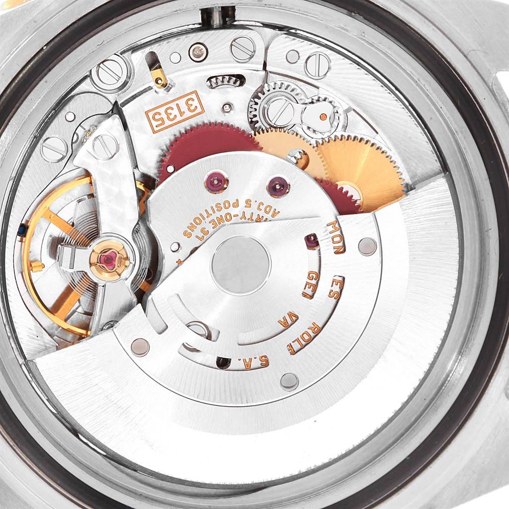 This image shows a close-up view of the movement inside a Rolex Submariner 16613 Men's Steel and Gold (two tone) Blue Dial 16613 Men's Steel and Gold (two tone) Blue Dial watch, revealing its intricate internal components.