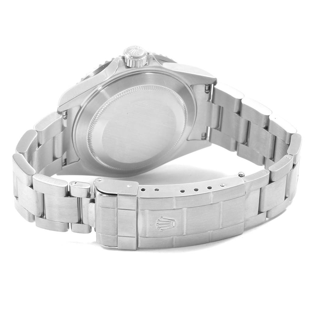 The image shows the back view of a Rolex Submariner 16610LV Men's Stainless Steel Black Dial 16610LV Men's Stainless Steel Black Dial watch, highlighting its case back and bracelet clasp.