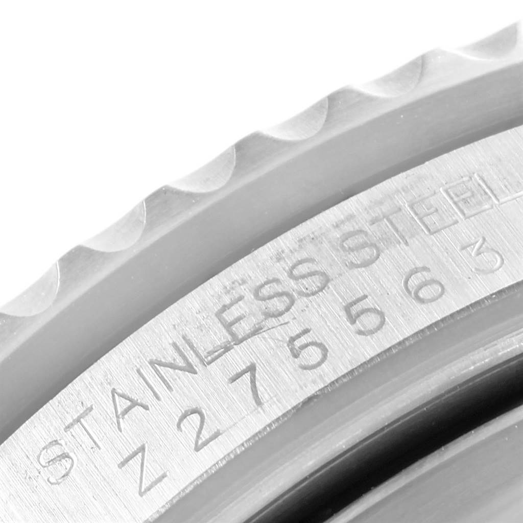 This close-up image shows the bezel and part of the stainless steel case of a Rolex Submariner 16610LV Men's Stainless Steel Black Dial 16610LV Men's Stainless Steel Black Dial watch.