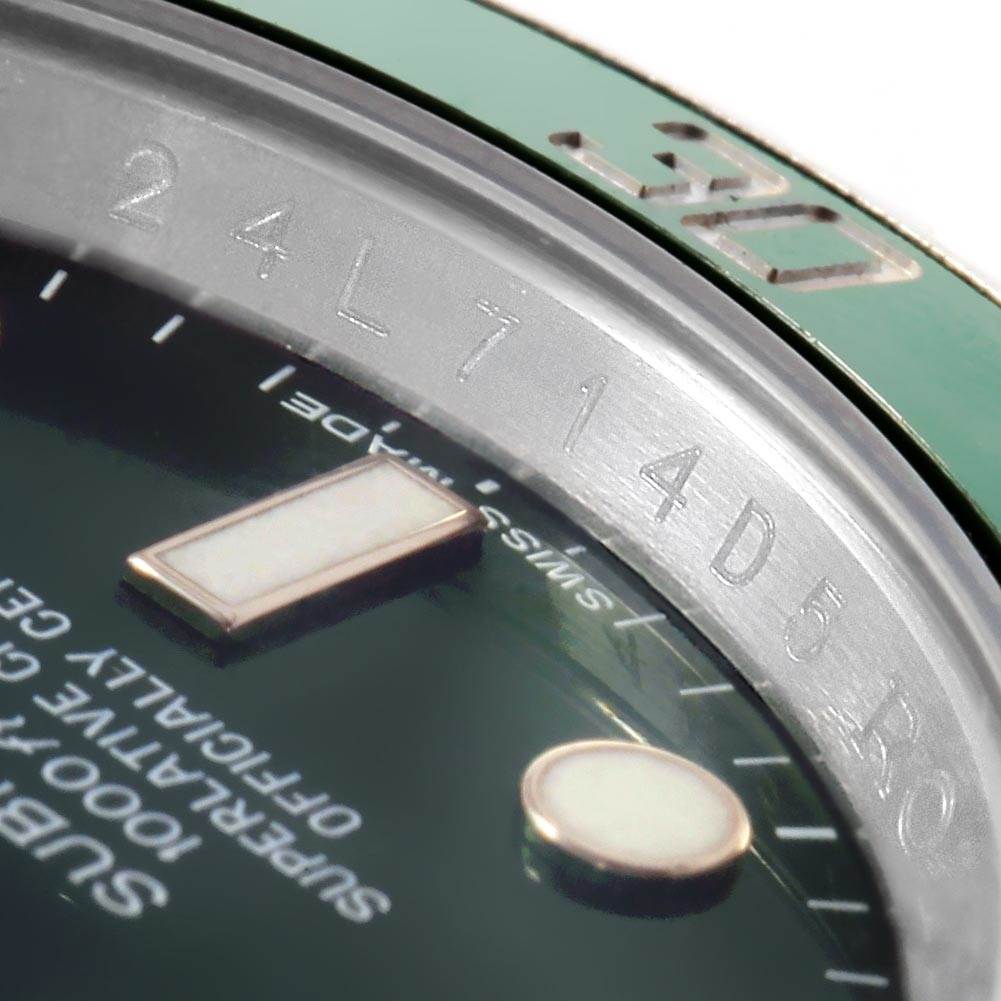 Close-up of the Rolex Submariner 116610LV Men's Stainless Steel Green Dial 116610LV Men's Stainless Steel Green Dial watch, showing the bezel, dial, and part of the case edge with engraved markings.
