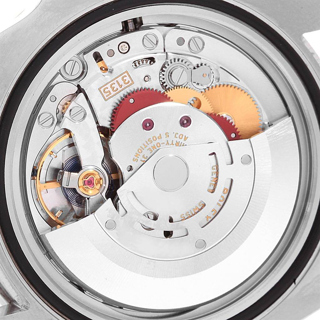 The image shows the internal mechanism, including gears and balance wheel, of a Rolex Submariner 116610LV Men's Stainless Steel Green Dial 116610LV Men's Stainless Steel Green Dial watch from the back view.