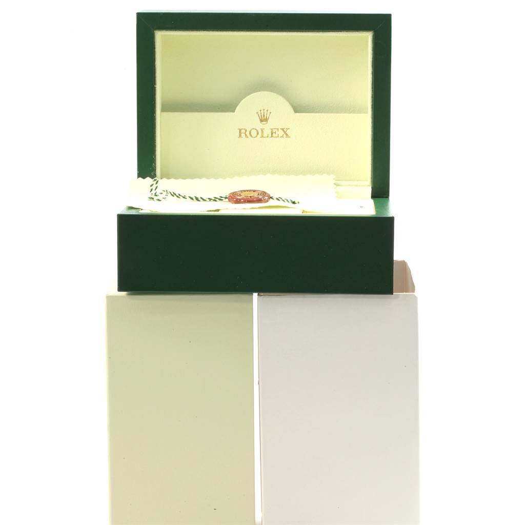 The image shows the open box and accessories for a Rolex Submariner 116610LV Men's Stainless Steel Green Dial 116610LV Men's Stainless Steel Green Dial watch, with tags and paperwork visible inside the box.