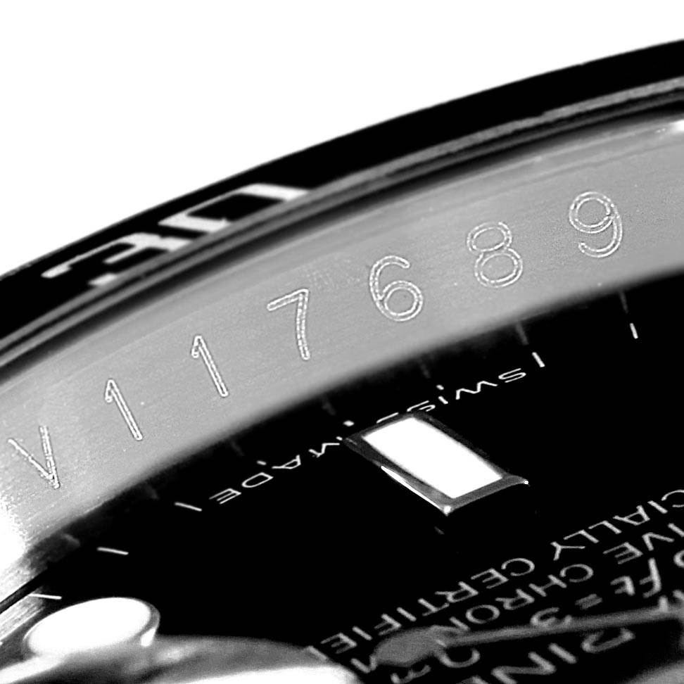 This close-up angle of the Rolex Submariner 16610 Men
s Stainless Steel Black Dial 16610 Men
s Stainless Steel Black Dial shows the rehaut with the engraved serial number and part of the watch face.