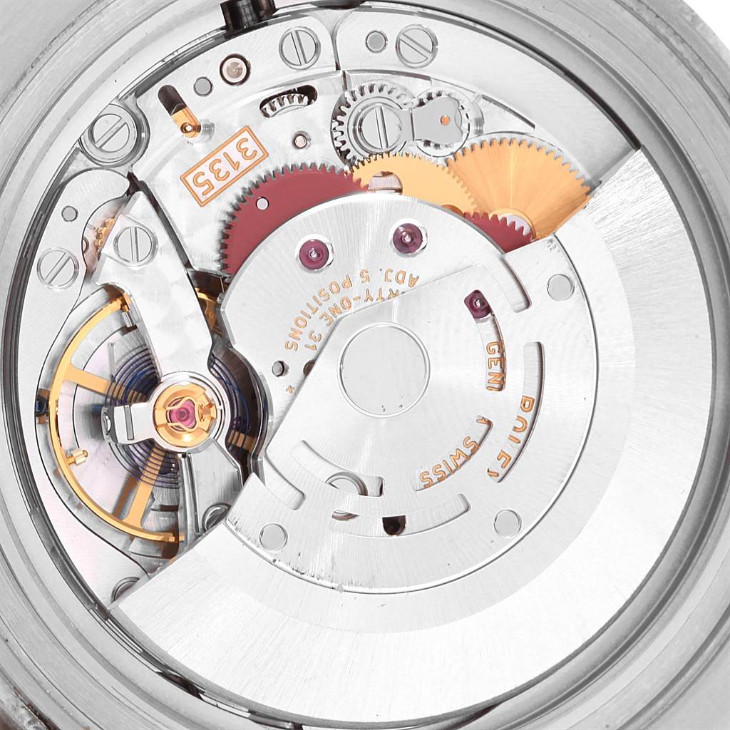 This image shows a close-up view of the internal movement mechanism of a Rolex Submariner 116610LV Men's Stainless Steel Green Dial 116610LV Men's Stainless Steel Green Dial watch.