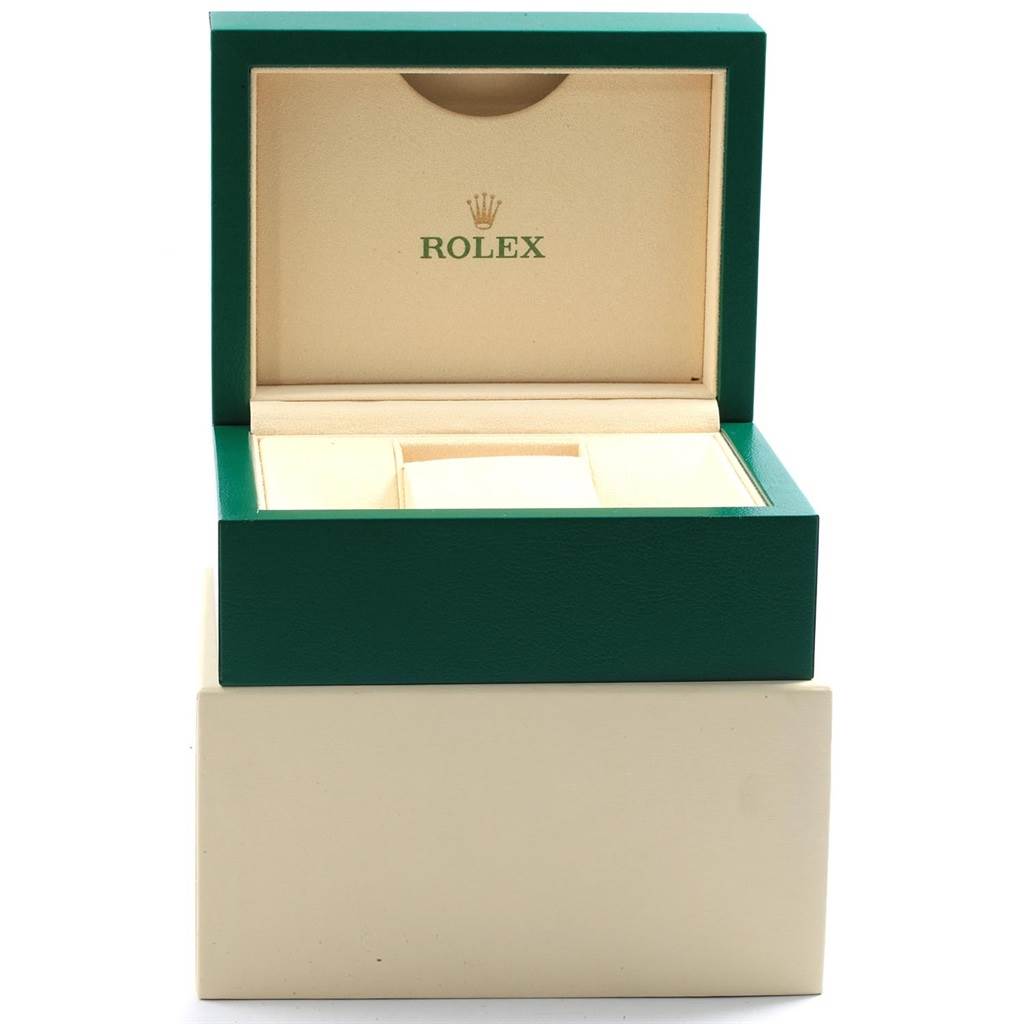 This image shows an open Rolex watch box, likely for the Submariner model, with the Rolex logo inside the lid.