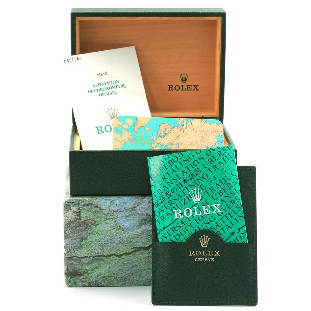The image shows the packaging, certificates, and a booklet for a Rolex Submariner 16613 Men's Steel and Gold (two tone) Grey Dial 16613 Men's Steel and Gold (two tone) Grey Dial watch with the box open.