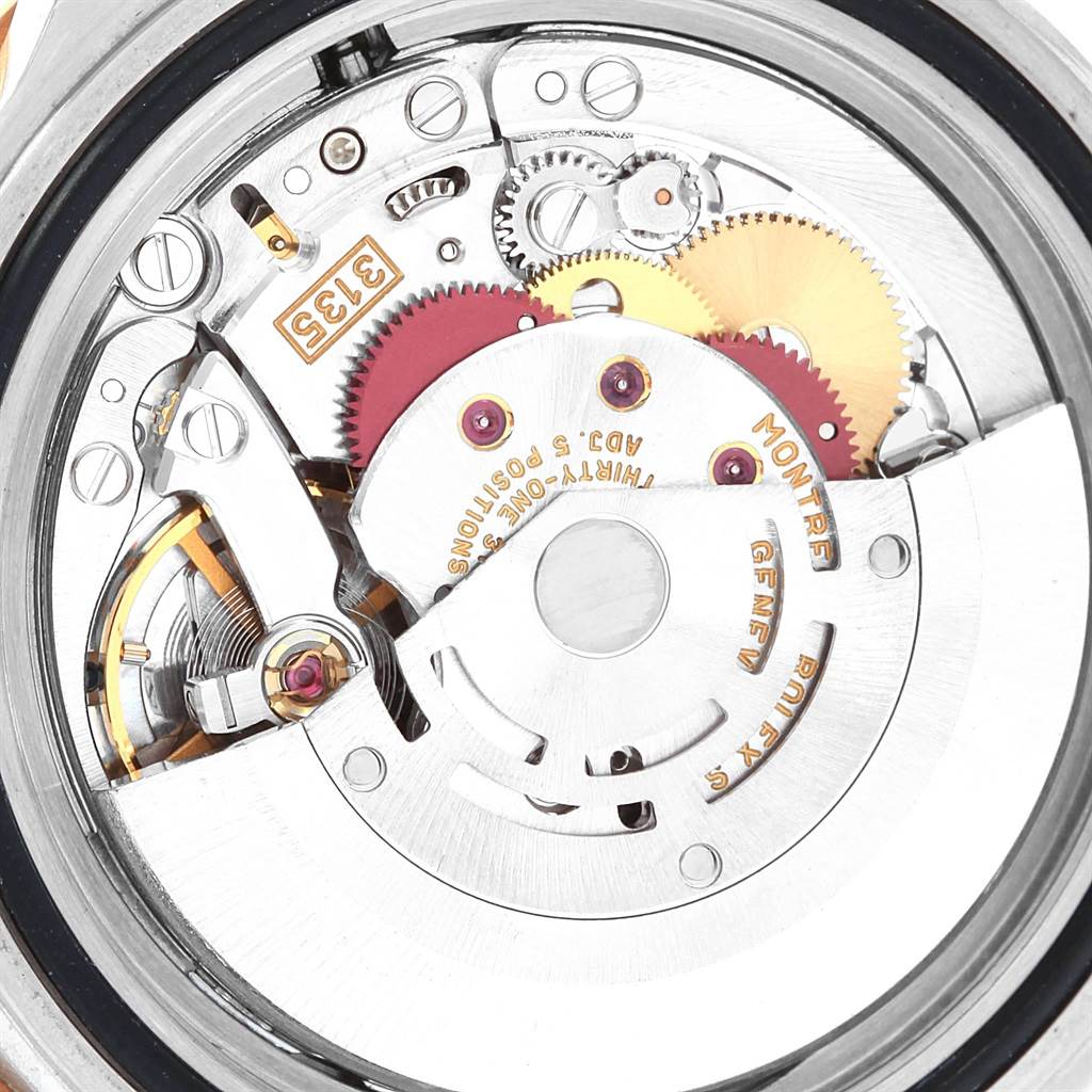 This image shows a close-up view of the internal mechanism and gears of a Rolex Submariner 16613 Men's Steel and Gold (two tone) Grey Dial 16613 Men's Steel and Gold (two tone) Grey Dial watch.