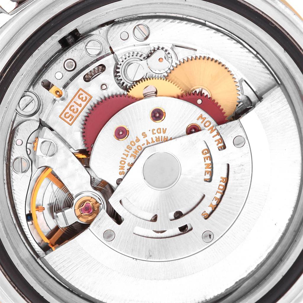 This image shows the movement mechanism of a Rolex Submariner 16613 Men's Steel and Gold (two tone) Champagne Dial 16613 Men's Steel and Gold (two tone) Champagne Dial watch, visible from the back.