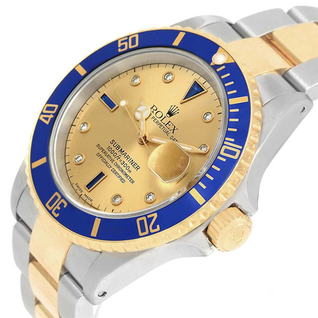 This image shows a close-up angle of a Rolex Submariner 16613 Men's Steel and Gold (two tone) Champagne Dial 16613 Men's Steel and Gold (two tone) Champagne Dial watch, highlighting its face, bezel, and part of the bracelet.