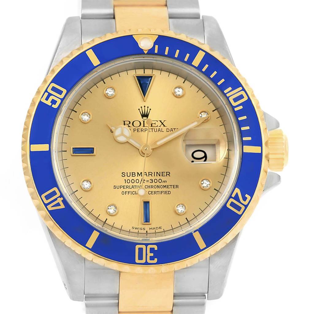 The image shows a front view of a Rolex Submariner 16613 Men's Steel and Gold (two tone) Champagne Dial 16613 Men's Steel and Gold (two tone) Champagne Dial watch, highlighting its gold dial and blue bezel.