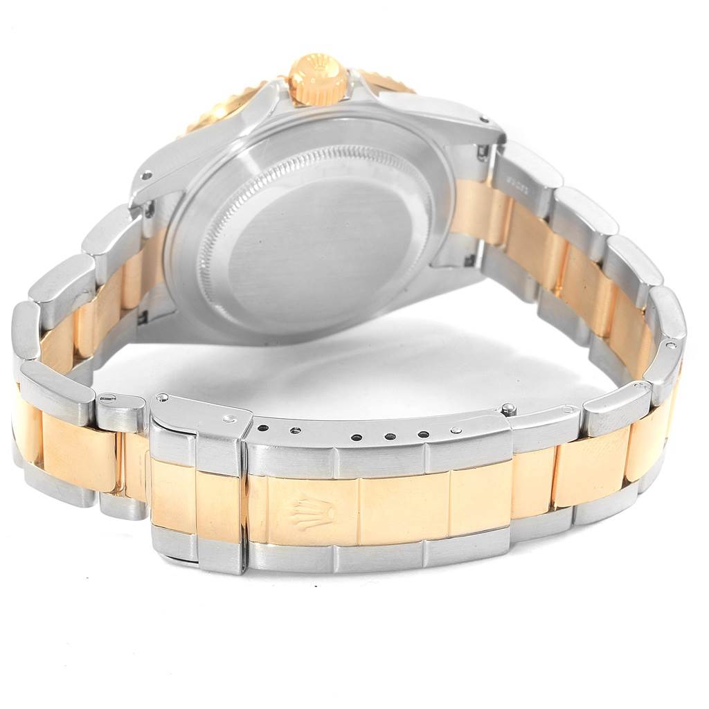 The image shows the back and band of a Rolex Submariner 16613 Men's Steel and Gold (two tone) Champagne Dial 16613 Men's Steel and Gold (two tone) Champagne Dial watch at an angled view.