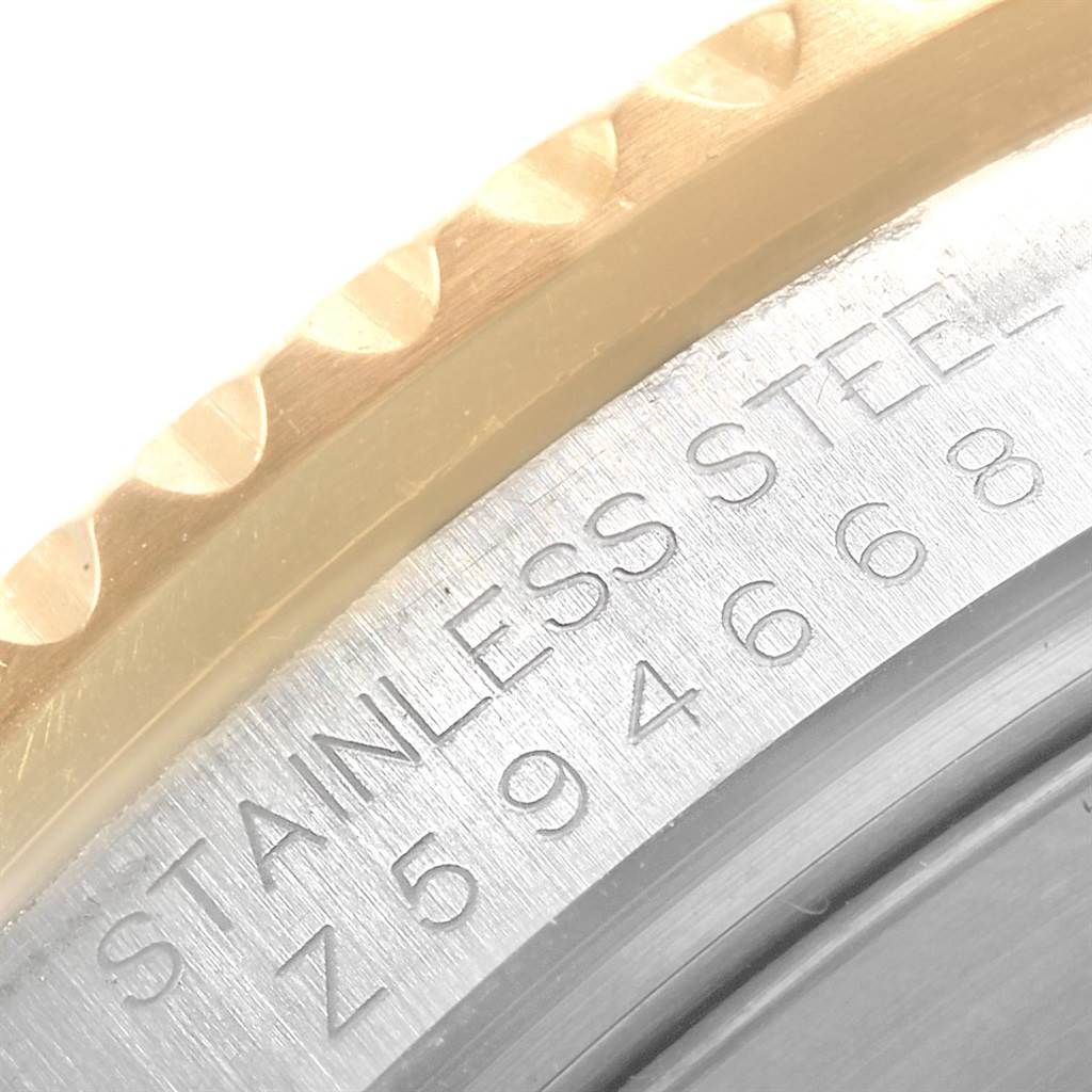 This close-up image shows the stainless steel case back and the edge of the bezel of the Rolex Submariner 16613 Men's Steel and Gold (two tone) Blue Dial 16613 Men's Steel and Gold (two tone) Blue Dial watch.
