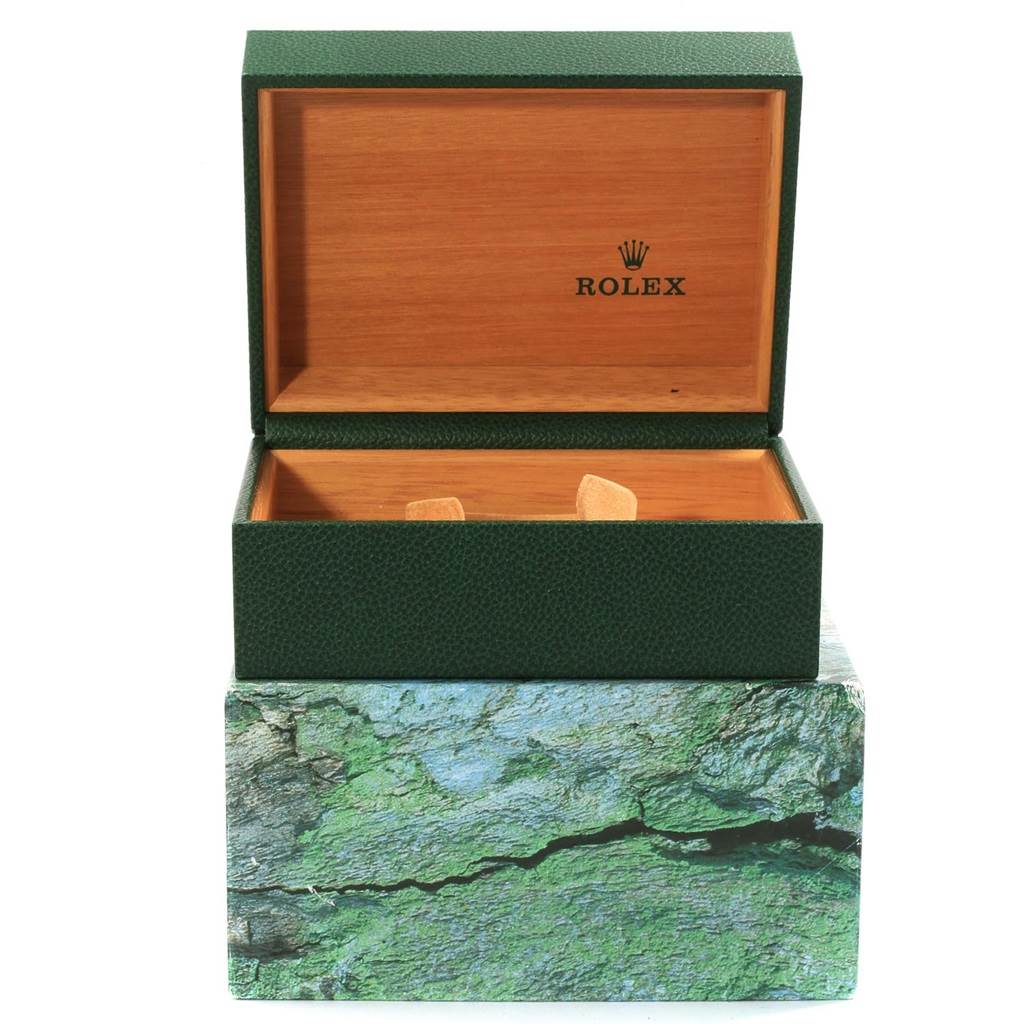 The image shows an open green Rolex Submariner 16613 Men's Steel and Gold (two tone) Blue Dial 16613 Men's Steel and Gold (two tone) Blue Dial watch box with the inner wooden lining visible.