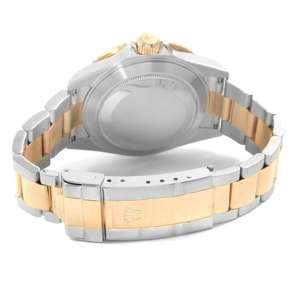 This image shows the back of a Rolex Submariner 16613 Men's Steel and Gold (two tone) Blue Dial 16613 Men's Steel and Gold (two tone) Blue Dial, highlighting its two-tone bracelet and closed clasp.