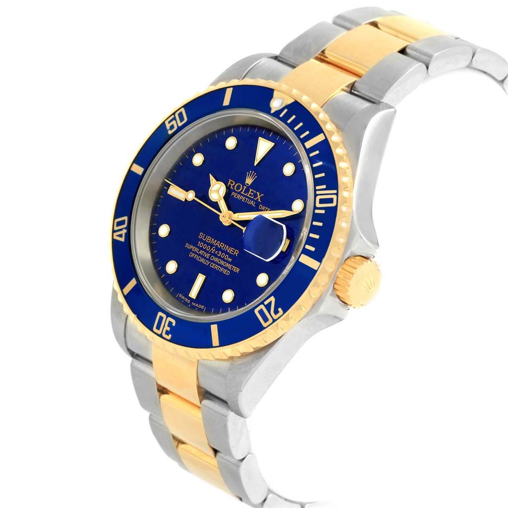 This image shows a side-angle view of a Rolex Submariner 16613 Men's Steel and Gold (two tone) Blue Dial 16613 Men's Steel and Gold (two tone) Blue Dial watch, focusing on the blue dial, bezel, crown, and two-tone bracelet.