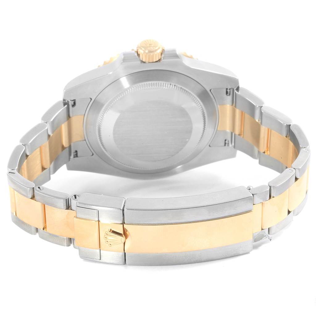 This image shows the back casing and folded clasp of a Rolex Submariner 116613 Men's Steel and Gold (two tone) Blue Dial 116613 Men's Steel and Gold (two tone) Blue Dial watch, displaying the two-tone bracelet.