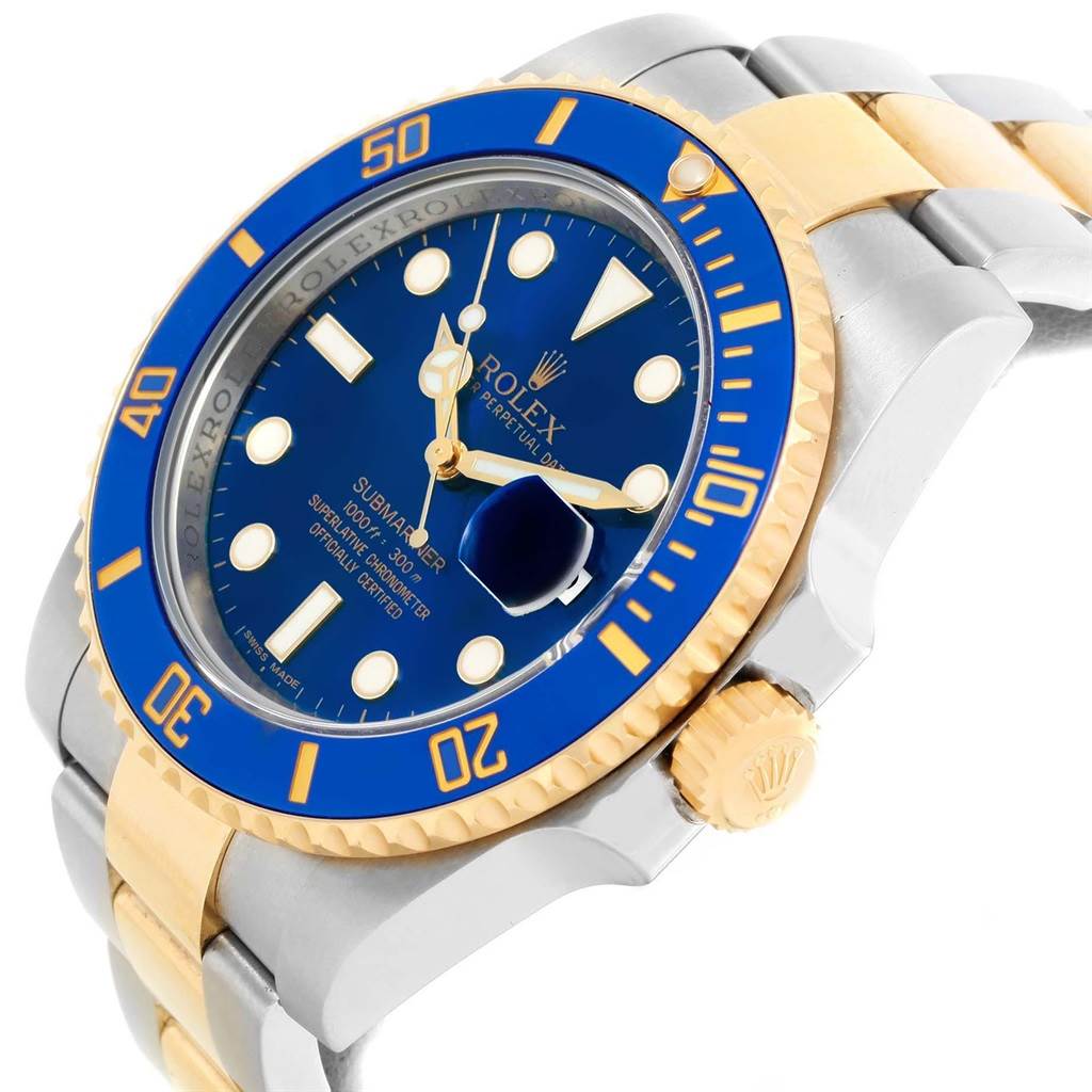 The image shows a close-up of a Rolex Submariner 116613 Men's Steel and Gold (two tone) Blue Dial 116613 Men's Steel and Gold (two tone) Blue Dial watch, highlighting its blue face, bezel, and two-tone bracelet from an angled side view.