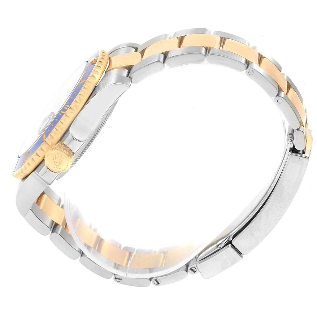 This image shows the side profile and band of the Rolex Submariner 116613 Men's Steel and Gold (two tone) Blue Dial 116613 Men's Steel and Gold (two tone) Blue Dial watch, highlighting its two-tone metal design and crown.