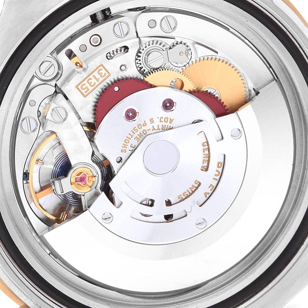 This image shows the internal mechanical movement parts of a Rolex Submariner 116613 Men's Steel and Gold (two tone) Blue Dial 116613 Men's Steel and Gold (two tone) Blue Dial watch from a rear angle.