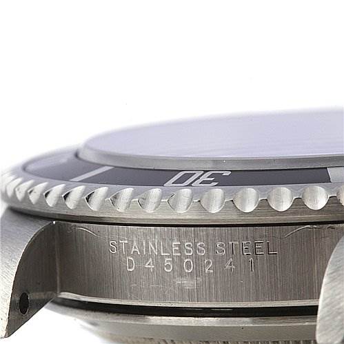 This close-up image of a Rolex Submariner 14060 Men's Stainless Steel Black Dial 14060 Men's Stainless Steel Black Dial watch shows the side of the case, focusing on the stainless steel material and serial number.