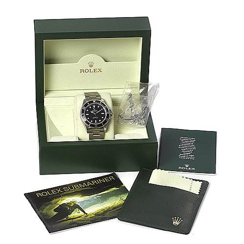 The image shows a Rolex Submariner 14060 Men's Stainless Steel Black Dial 14060 Men's Stainless Steel Black Dial watch at a front angle, displayed in its box with a booklet, cardholder, and cleaning cloth.