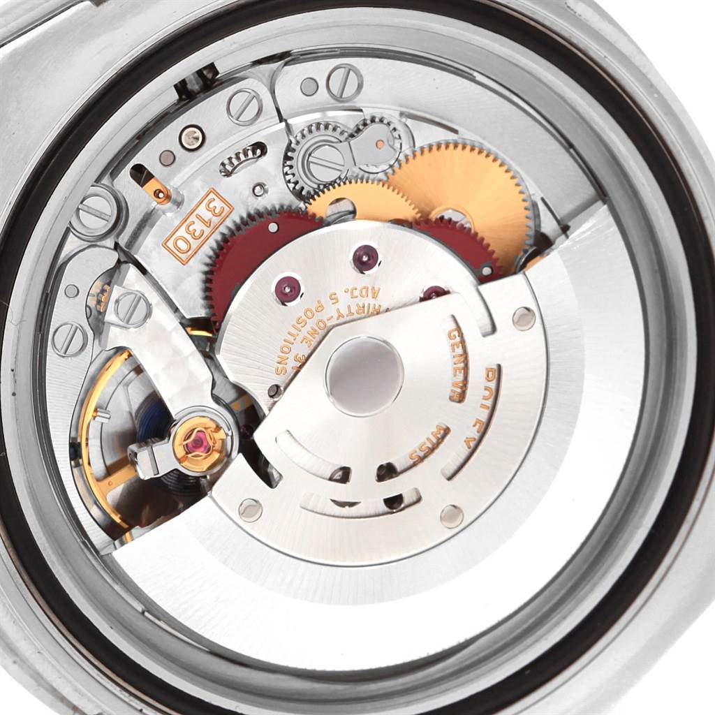 This image shows a close-up view of the internal mechanism of a Rolex Submariner 114060 Men's Stainless Steel Black Dial 114060 Men's Stainless Steel Black Dial watch, highlighting its intricate gears and rotor.