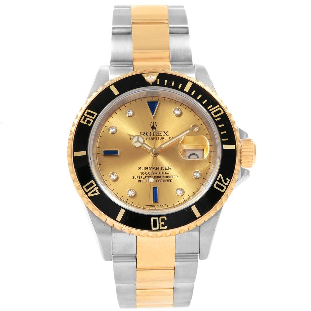 This Rolex Submariner 16613 Men's Steel and Gold (two tone) Champagne Dial 16613 Men's Steel and Gold (two tone) Champagne Dial watch is shown from a front angle, displaying the dial, bezel, and two-tone bracelet.