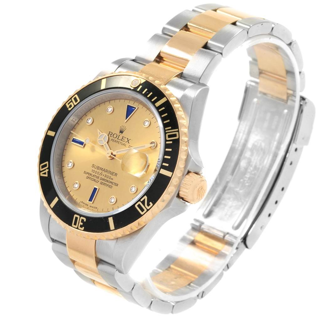 This image shows a Rolex Submariner 16613 Men's Steel and Gold (two tone) Champagne Dial 16613 Men's Steel and Gold (two tone) Champagne Dial watch at a three-quarter angle, displaying the face, bezel, and bracelet.
