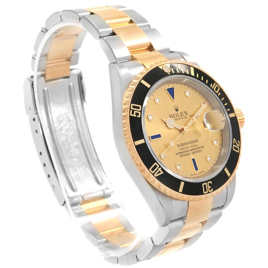 The image shows a side angle of a Rolex Submariner 16613 Men's Steel and Gold (two tone) Champagne Dial 16613 Men's Steel and Gold (two tone) Champagne Dial watch, revealing the dial, bezel, case, and part of the bracelet.