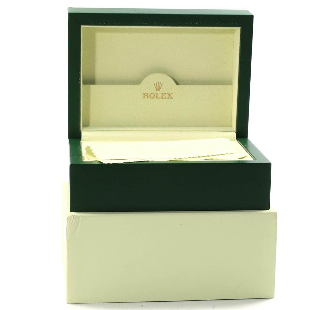 This image shows an open green and beige Rolex Submariner 16613 Men's Steel and Gold (two tone) Champagne Dial 16613 Men's Steel and Gold (two tone) Champagne Dial watch box, displaying the inner compartment.