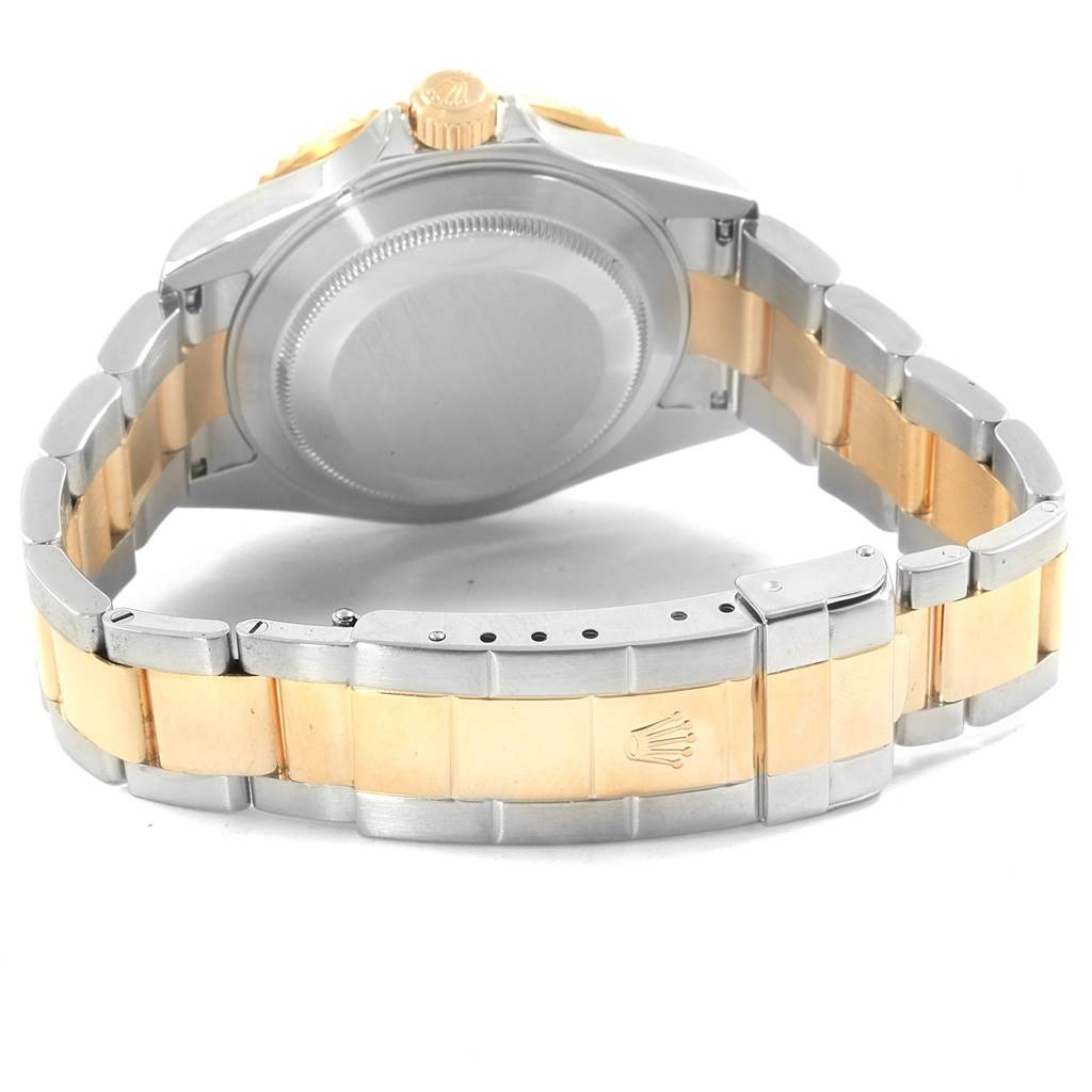 The image displays the back case and bracelet of a Rolex Submariner 16613 Men's Steel and Gold (two tone) Champagne Dial 16613 Men's Steel and Gold (two tone) Champagne Dial watch, highlighting the stainless steel and gold links.