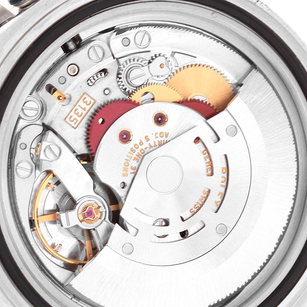 The image shows a close-up of the movement mechanism of a Rolex Submariner 16613 Men's Steel and Gold (two tone) Champagne Dial 16613 Men's Steel and Gold (two tone) Champagne Dial watch, highlighting gears and intricate components.