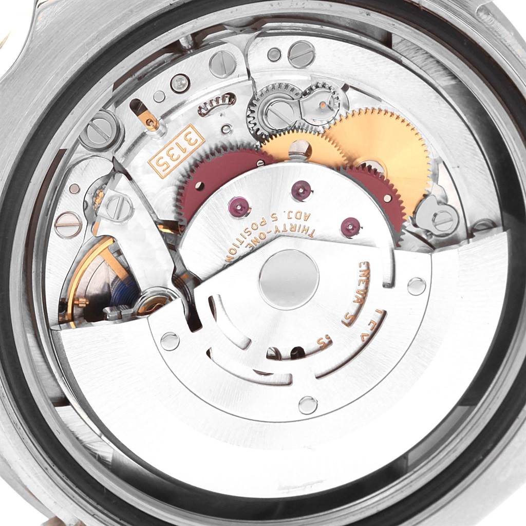 This image shows the detailed mechanical movement of a Rolex Submariner 116619 Men's White Gold Blue Dial 116619 Men's White Gold Blue Dial watch from a close-up, top-down angle.