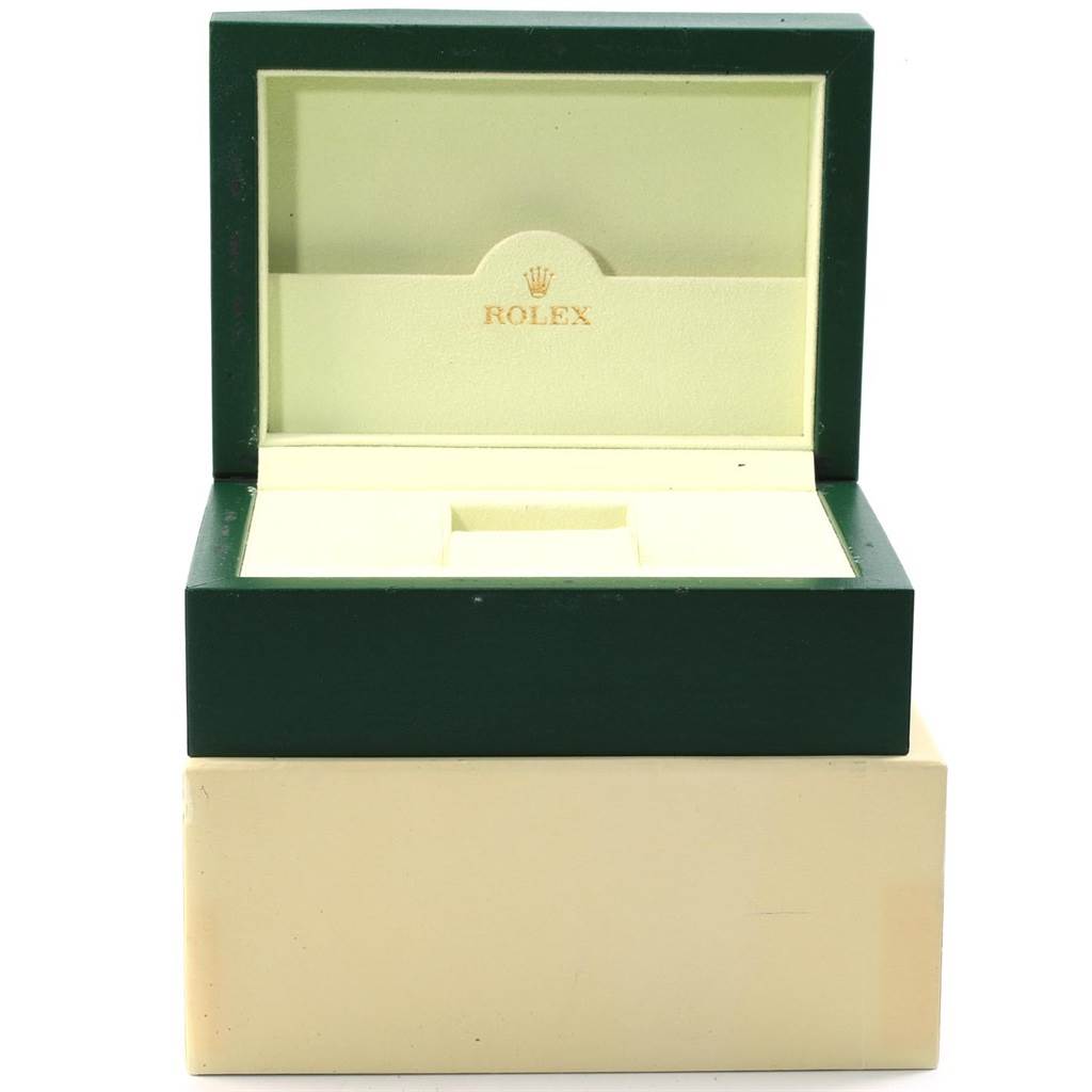 This image shows an open Rolex box for the Submariner model, displaying the inner velvet lining and "Rolex" logo.