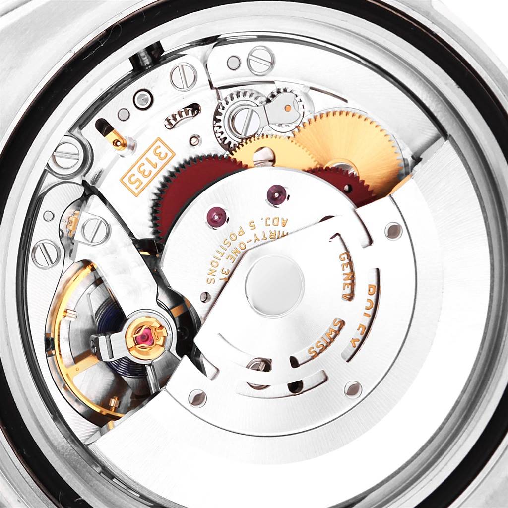 The image shows a close-up view of the internal movement of a Rolex Submariner 116610LV Men's Stainless Steel Green Dial 116610LV Men's Stainless Steel Green Dial watch.