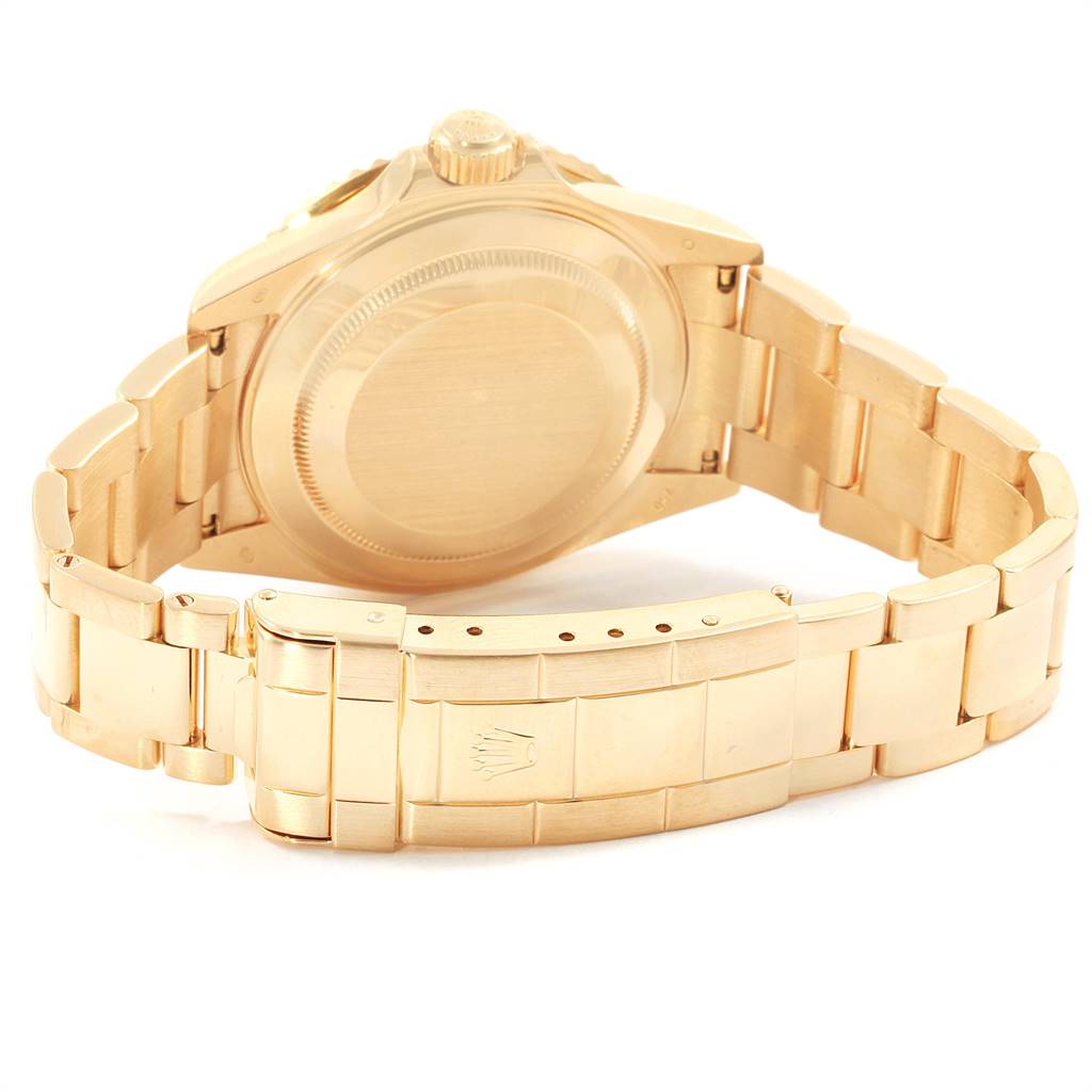 The image shows the case back and bracelet clasp of a Rolex Submariner 16618 Men's Yellow Gold Black Dial 16618 Men's Yellow Gold Black Dial watch from a rear angle.