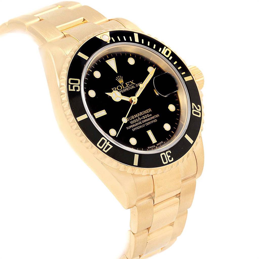 The image shows a Rolex Submariner 16618 Men's Yellow Gold Black Dial 16618 Men's Yellow Gold Black Dial watch at an angled view, highlighting its gold bracelet and black dial with luminescent markers.