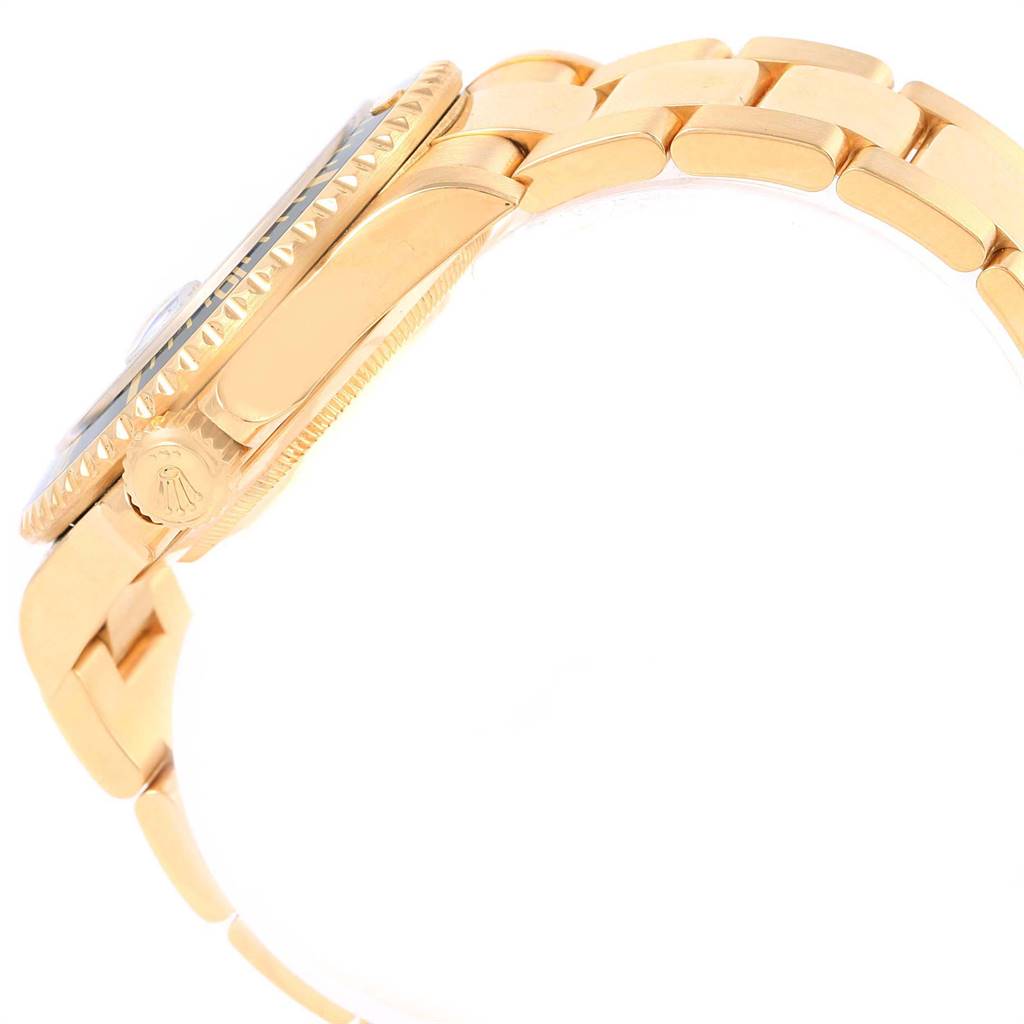 The image shows a side view of a Rolex Submariner 16618 Men's Yellow Gold Black Dial 16618 Men's Yellow Gold Black Dial's case, bezel, crown, and part of its gold bracelet.