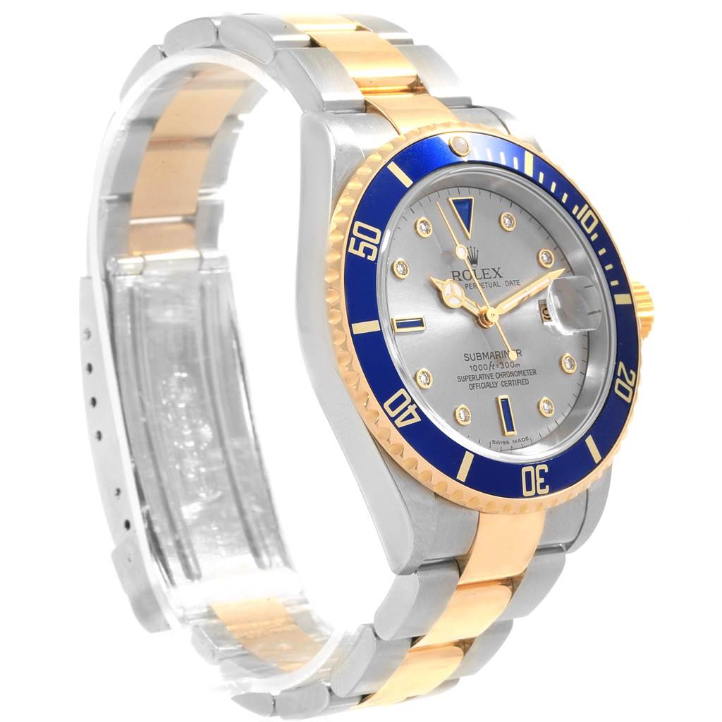 This image shows a Rolex Submariner 16613 Men's Steel and Gold (two tone) Grey Dial 16613 Men's Steel and Gold (two tone) Grey Dial watch at a three-quarter angle, highlighting its dial, bezel, and two-tone bracelet.