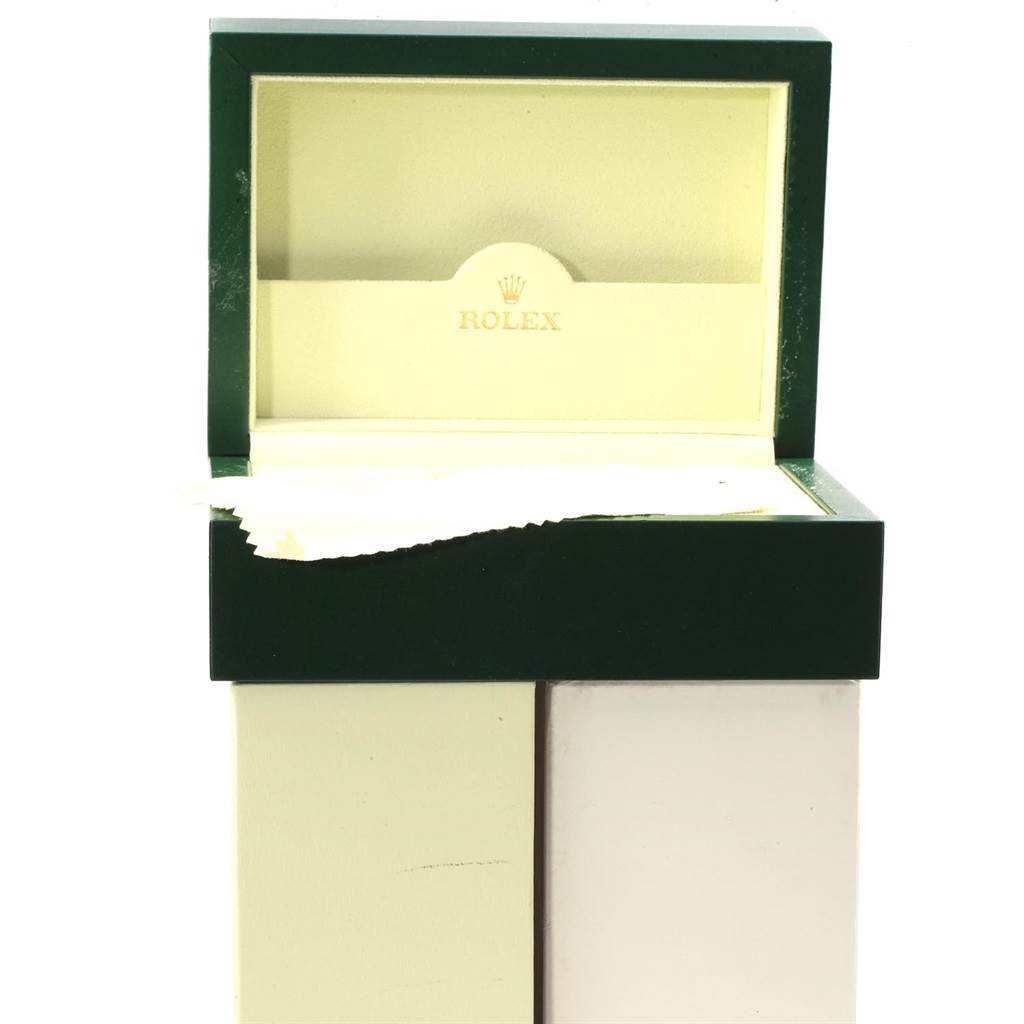 The image shows an open Rolex box for a Submariner model, viewed from the front, highlighting the interior and the branded lid.